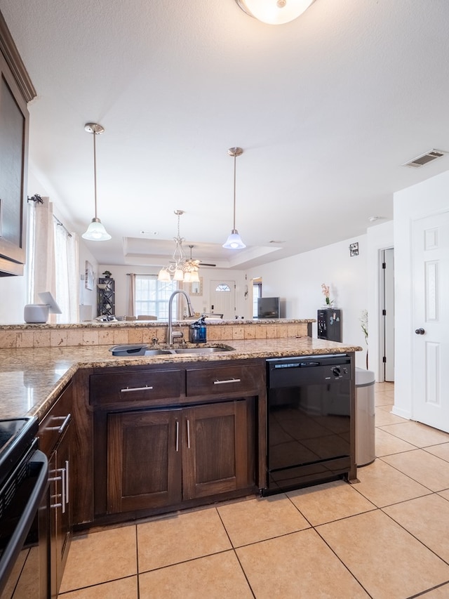 kitchen with pendant lighting, dishwasher, sink, light tile patterned floors, and dark brown cabinetry