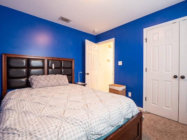 bedroom with carpet floors and a closet