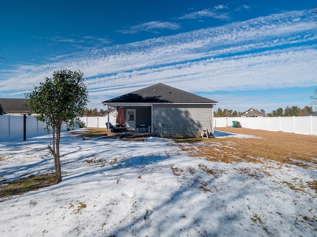 view of snow covered house