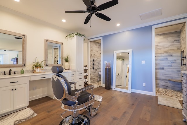 interior space with a shower, crown molding, vanity, and wood-type flooring