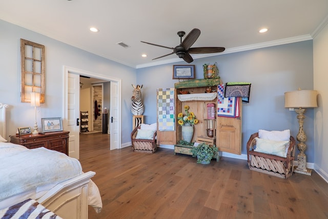 bedroom with dark hardwood / wood-style floors, ceiling fan, and ornamental molding