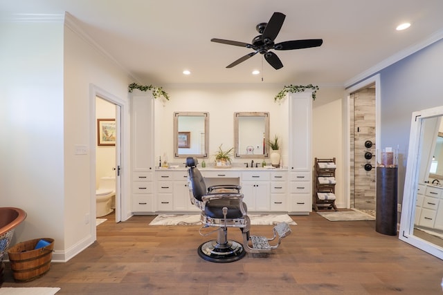 bathroom with walk in shower, ornamental molding, ceiling fan, hardwood / wood-style floors, and toilet