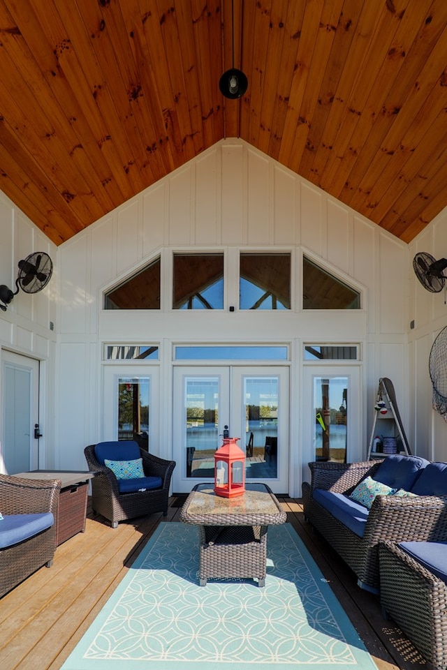 view of patio / terrace with outdoor lounge area, a wooden deck, and french doors