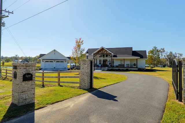 view of front of property with a garage and a front lawn