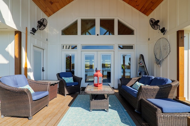 view of patio / terrace with a wooden deck, an outdoor living space, and french doors