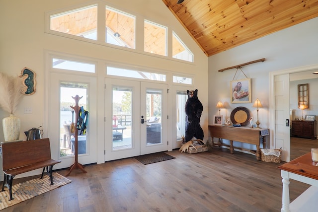 entryway with a wealth of natural light, french doors, dark hardwood / wood-style flooring, high vaulted ceiling, and wood ceiling