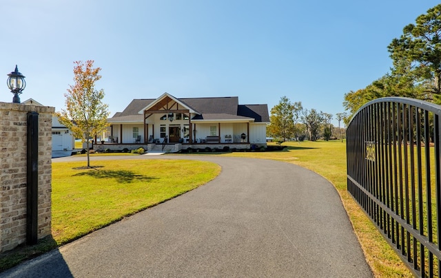 view of front of house with a porch and a front yard