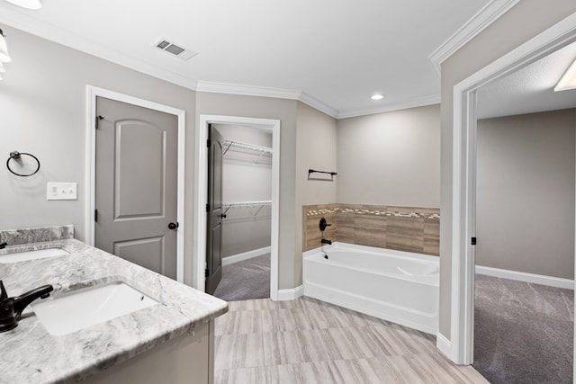 4234 Whithorn Way, Valdosta, GA 31605 - bathroom with a bath, double vanity, a spacious closet, crown molding, and recessed lighting