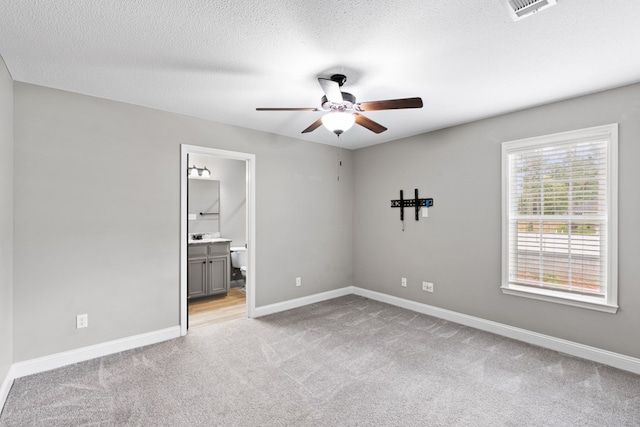 4234 Whithorn Way, Valdosta, GA 31605 - spare room featuring ceiling fan, light carpet, and a textured ceiling