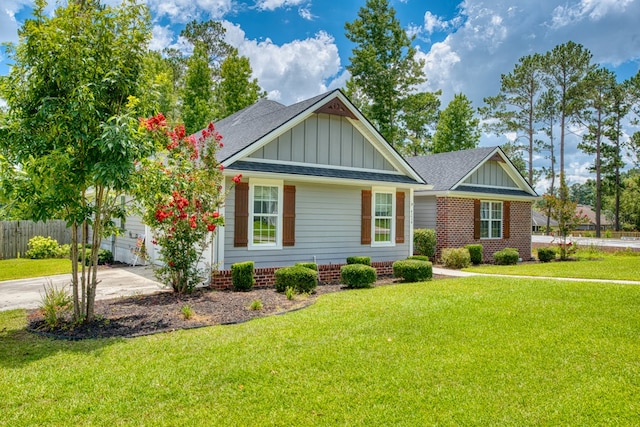 4234 Whithorn Way, Valdosta, GA 31605 - view of front of house with board and batten siding, a shingled roof, and concrete driveway