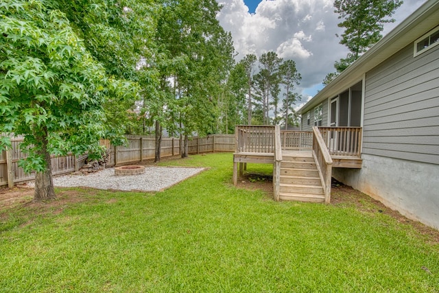 4234 Whithorn Way, Valdosta, GA 31605 - fenced backyard with a fire pit, a wooden deck, and stairs