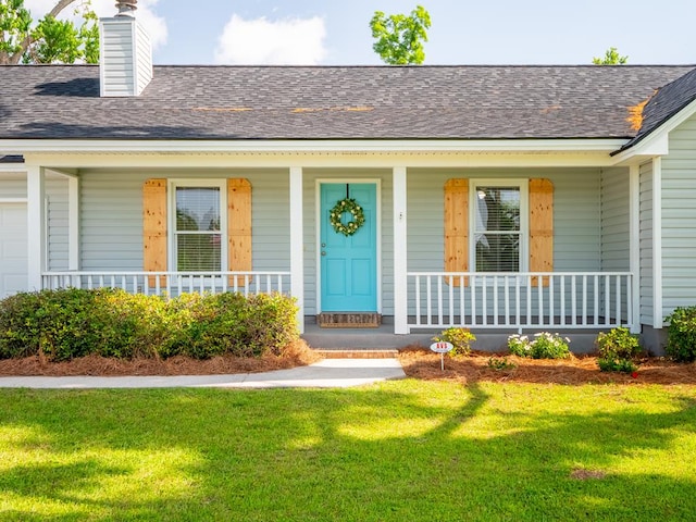 3875 Studstill Rd, Valdosta, GA 31605 - doorway to property with a porch, a shingled roof, a yard, and a chimney
