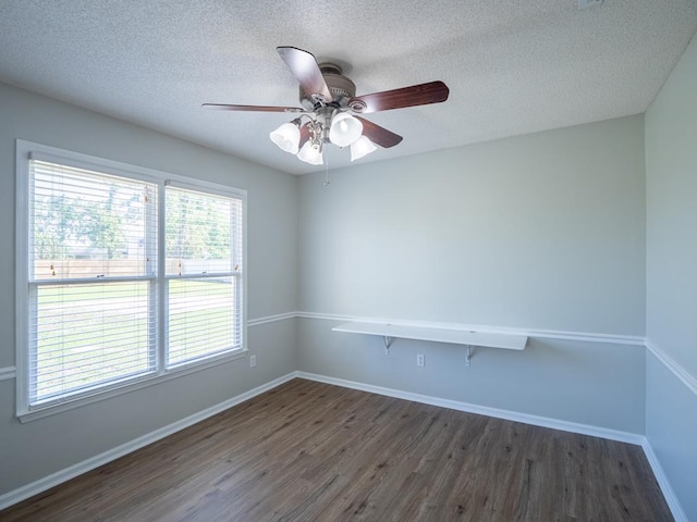 3875 Studstill Rd, Valdosta, GA 31605 - spare room featuring dark wood finished floors, ceiling fan, baseboards, and a textured ceiling