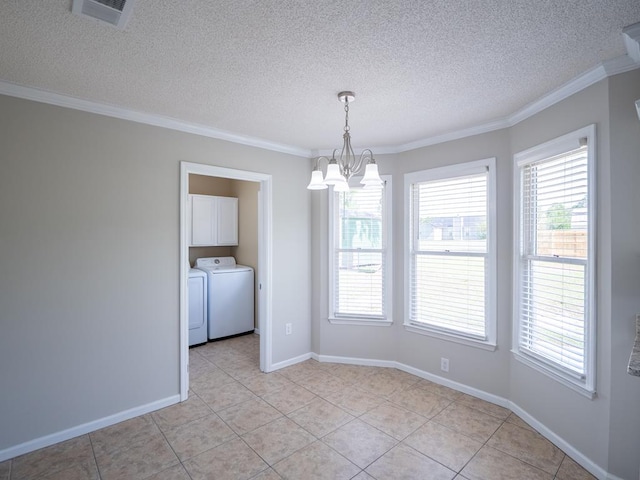 3875 Studstill Rd, Valdosta, GA 31605 - unfurnished dining area featuring independent washer and dryer, a chandelier, plenty of natural light, a textured ceiling, and ornamental molding