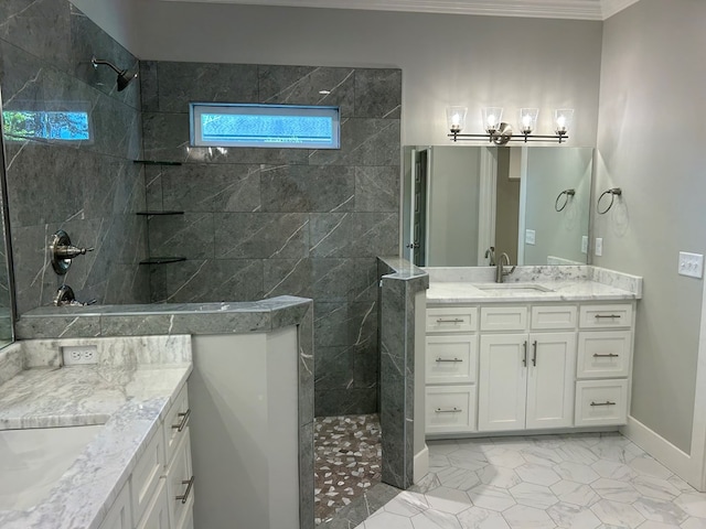 bathroom featuring vanity, crown molding, and tiled shower