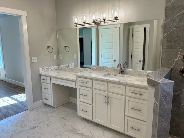 bathroom with hardwood / wood-style flooring and vanity