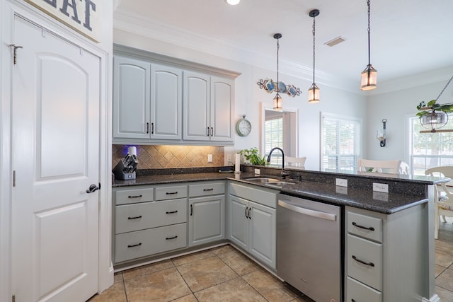 kitchen featuring pendant lighting, sink, stainless steel dishwasher, gray cabinets, and kitchen peninsula