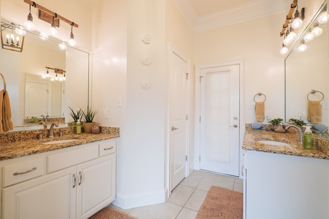 bathroom with crown molding, tile patterned flooring, and vanity