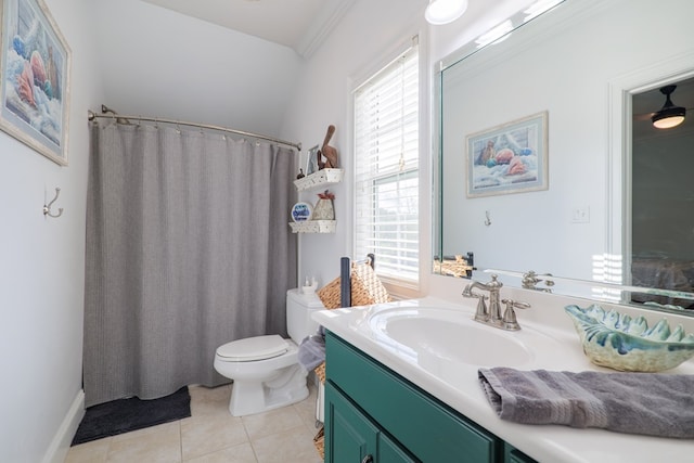 bathroom featuring toilet, vanity, tile patterned floors, and plenty of natural light