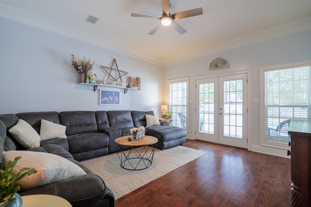 living room with french doors, crown molding, plenty of natural light, and dark hardwood / wood-style floors