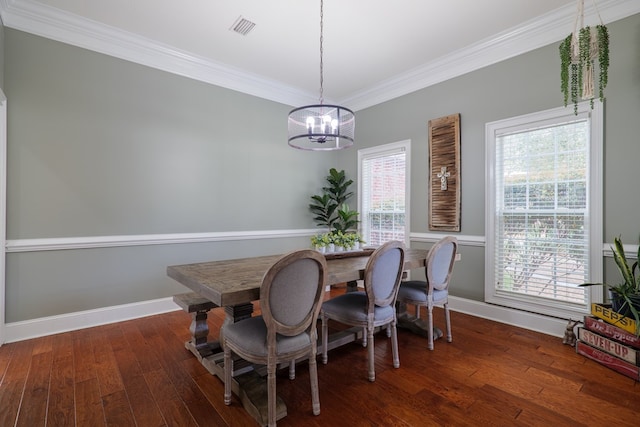 dining room with a healthy amount of sunlight, dark hardwood / wood-style floors, and a notable chandelier