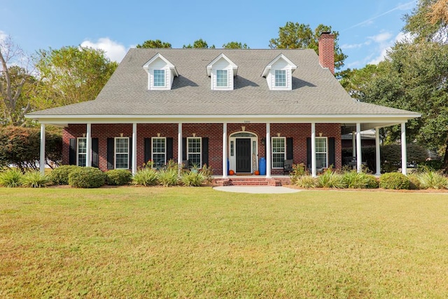 view of front facade with a front lawn and covered porch