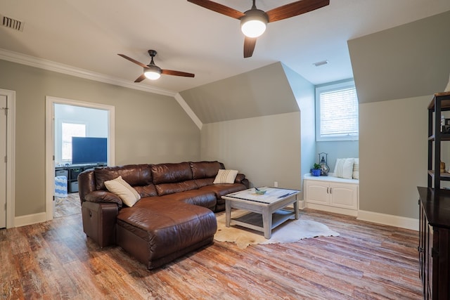 living room with hardwood / wood-style floors, ceiling fan, lofted ceiling, and a wealth of natural light