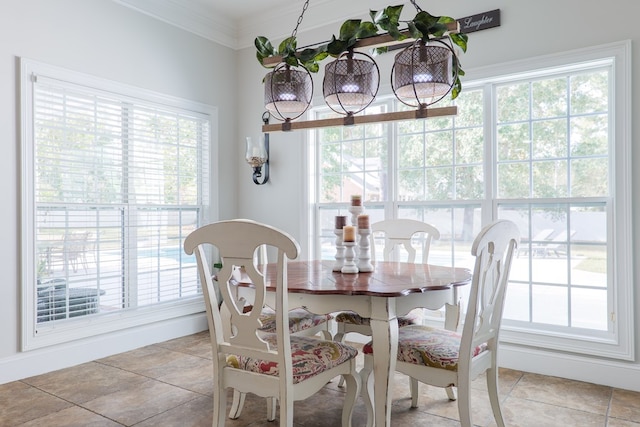 dining area featuring crown molding