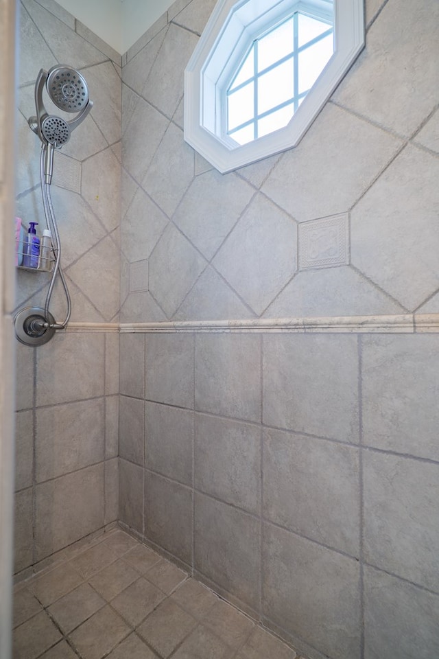 bathroom with a tile shower