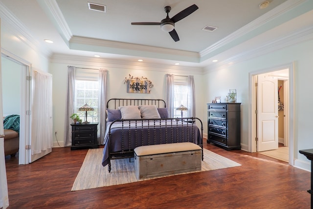 bedroom with ceiling fan, dark hardwood / wood-style flooring, crown molding, and multiple windows