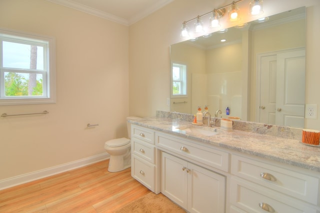 bathroom featuring hardwood / wood-style floors, vanity, a shower, crown molding, and toilet