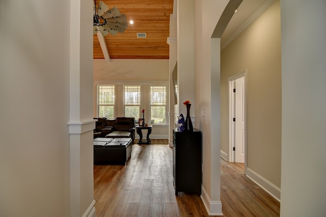 corridor with hardwood / wood-style floors, high vaulted ceiling, wooden ceiling, and beamed ceiling