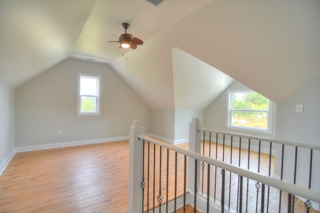 bonus room featuring ceiling fan, light hardwood / wood-style floors, and lofted ceiling