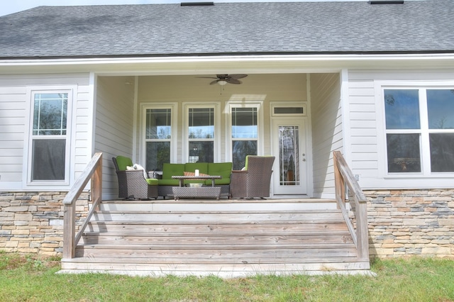 entrance to property with ceiling fan and a porch