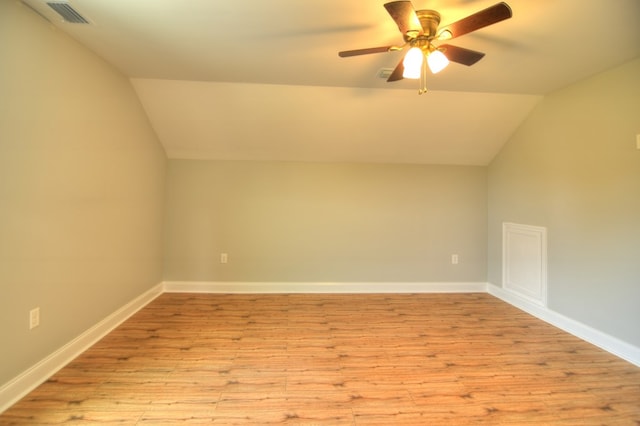 additional living space featuring ceiling fan, light wood-type flooring, and lofted ceiling