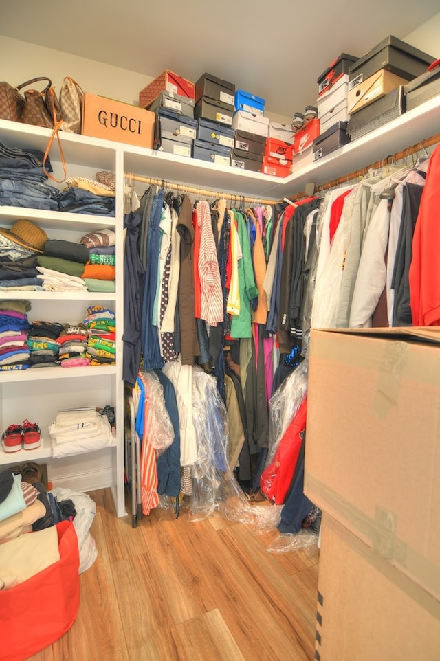 walk in closet featuring light hardwood / wood-style flooring