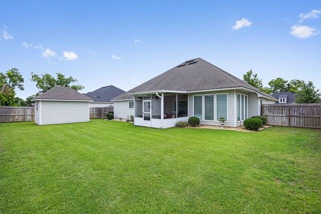 4740 Amelia Cir, Hahira, GA 31632 - rear view of house with a sunroom and a shingled roof