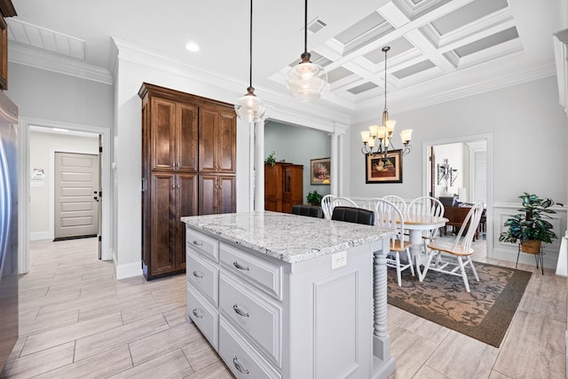 4740 Amelia Cir, Hahira, GA 31632 - kitchen featuring ornamental molding, light stone countertops, ornate columns, pendant lighting, and a kitchen island