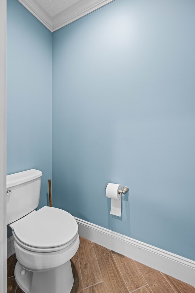4740 Amelia Cir, Hahira, GA 31632 - bathroom featuring toilet, wood finished floors, and baseboards