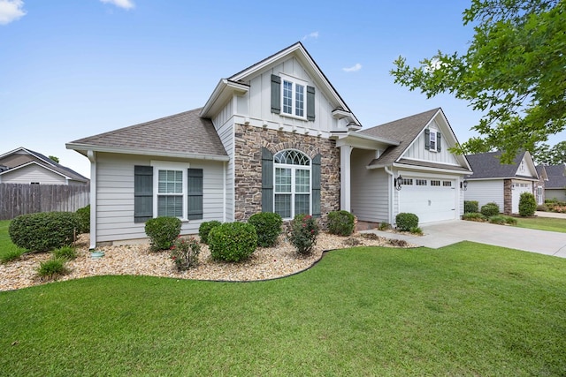 4740 Amelia Cir, Hahira, GA 31632 - view of front of property featuring board and batten siding, stone siding, concrete driveway, and a garage