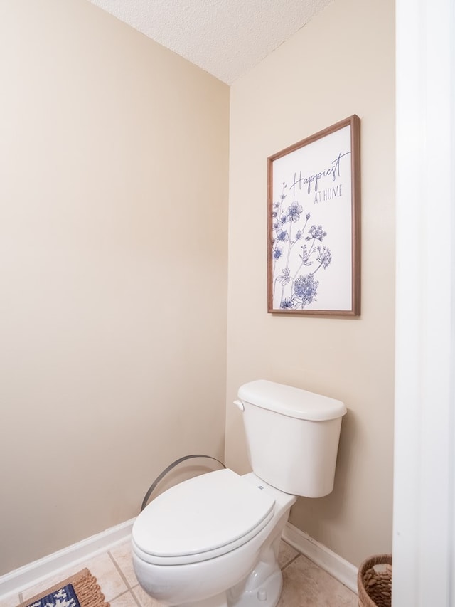 2951 Findley Chase, Valdosta, GA 31605 - bathroom featuring toilet, tile patterned floors, a textured ceiling, and baseboards