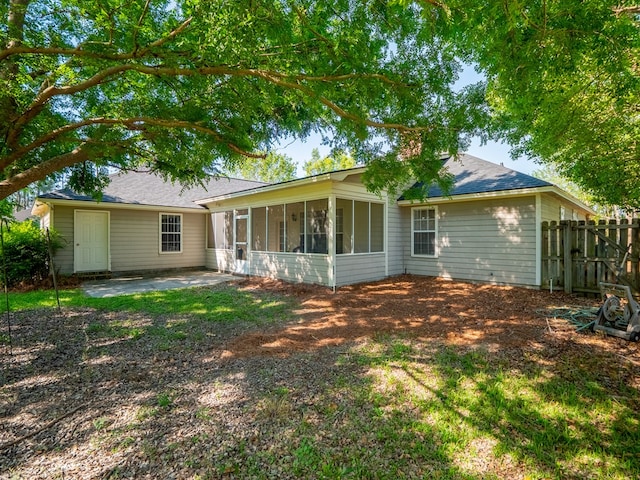2951 Findley Chase, Valdosta, GA 31605 - back of house featuring a patio area, a sunroom, and fence