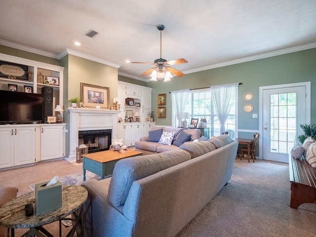 2951 Findley Chase, Valdosta, GA 31605 - living area featuring light colored carpet, crown molding, a healthy amount of sunlight, and a fireplace