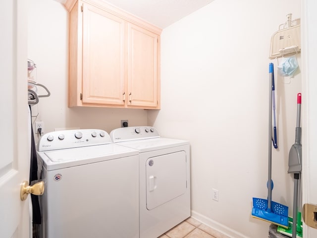 2951 Findley Chase, Valdosta, GA 31605 - washroom featuring cabinet space, washing machine and dryer, baseboards, and light tile patterned flooring