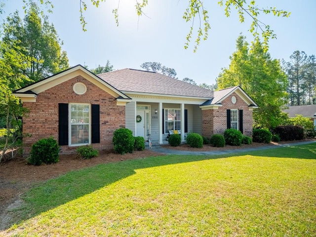 2951 Findley Chase, Valdosta, GA 31605 - single story home with a front lawn, brick siding, a shingled roof, and covered porch