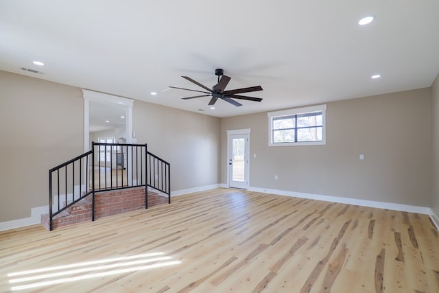 interior space with ceiling fan and light hardwood / wood-style flooring