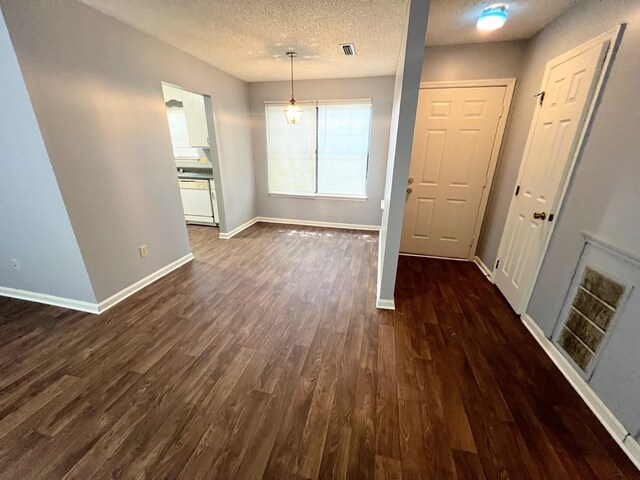 957 Mcafina Trl, Valdosta, GA 31602 - interior space featuring a textured ceiling and dark hardwood / wood-style floors