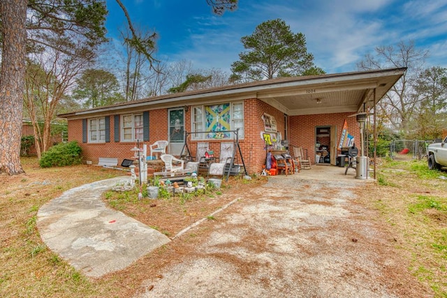 ranch-style house with a carport