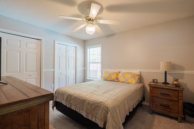 4604 Rustic Ridge Rd, Valdosta, GA 31602 - bedroom with carpet floors, multiple closets, and a ceiling fan