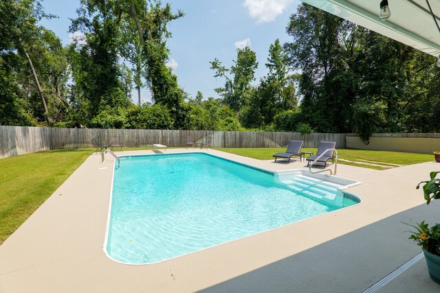 4604 Rustic Ridge Rd, Valdosta, GA 31602 - view of swimming pool with a patio, a fenced backyard, and view of scattered trees